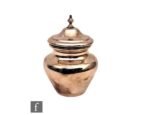 A hallmarked silver tea caddy of plain baluster form with pull off cover terminating in urn finial, weight 6oz, Edinburgh 190