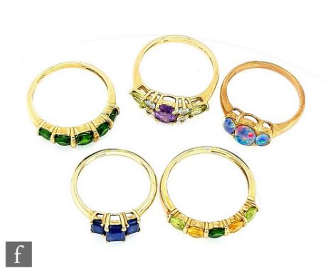 Five 9ct hallmarked stone set rings to include amethyst, opal doublet and other examples, total weight 10.5g, various styles 