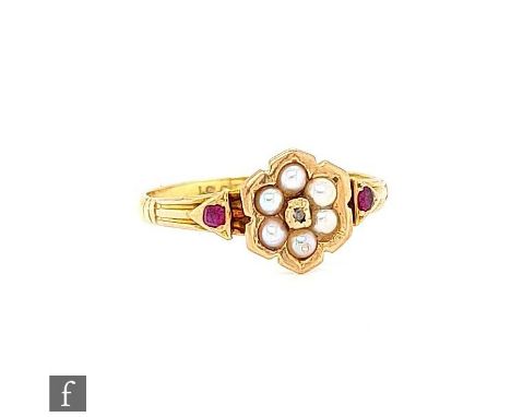 An early 20th Century ruby, seed pearl and diamond cluster ring, central diamond within a pearl six stone border flanked with