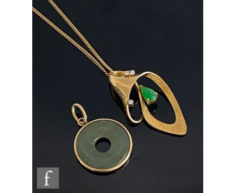 A 14ct modern open scroll pendant set with tear shaped jade and three brilliant cut diamonds, length 4cm, suspended from a 14