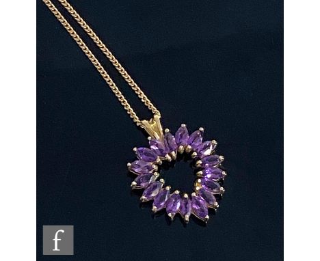 A 9ct hallmarked amethyst open heart shaped pendant comprising seventeen marquise cut, claw set stones, length 3cm, all suspe