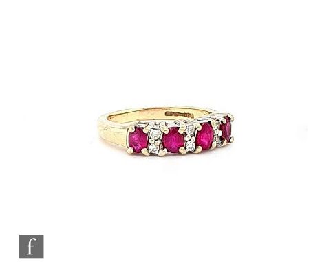 A 9ct hallmarked ruby and diamond ring, four oval rubies paced by pairs of brilliant cut diamonds, weight 2.8g, ring size K. 