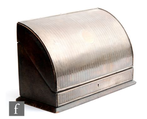 A hallmarked silver and leather stationary box, the engine turned silver front opening to blue silk lined interior, length 30