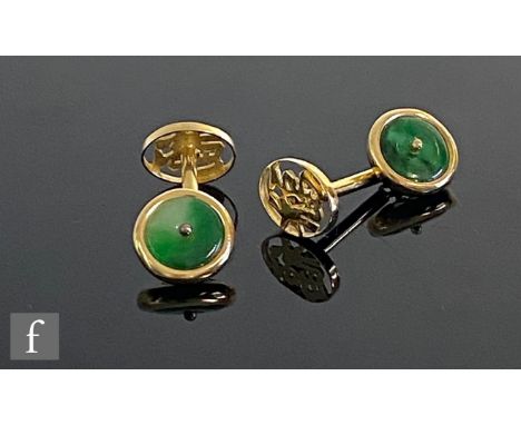 A pair of 14ct cufflinks with circular jade panel and Chinese characters united by a plain cylindrical bar, weight 4.3g, leng