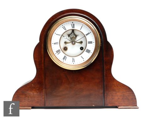 A late 19th Century walnut eight day strike mantle clock, white enamelled dial with visible escapement striking on a bell, mo