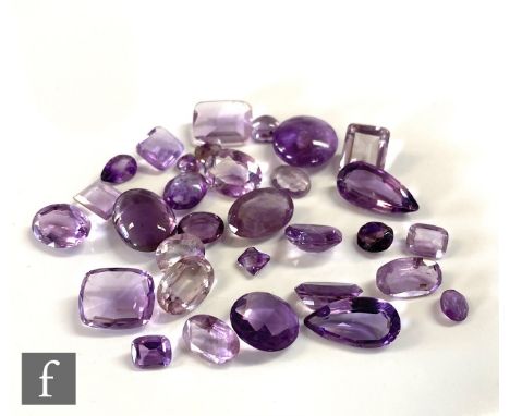 Thirty one assorted loose cut and polished amethyst stones to include pear, emerald and oval cuts, S/D. (31) 