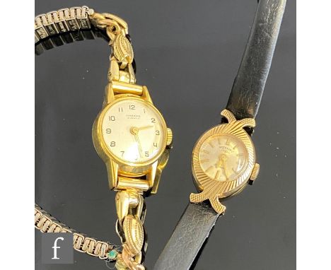 A lady's 9ct Rotary wrist watch, batons to a circular dial and leather strap, total weight 8g, with a similar gold plated exa