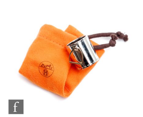 A Hermes Etrier Laiton scarf ring, length 25mm, within a conforming orange pouch. 