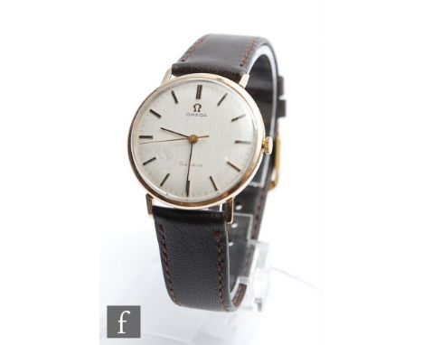 A mid 20th Century gentleman's 9ct Omega Geneve manual wrist watch, batons to a cream&nbsp; dial, case diameter 34mm, to a br