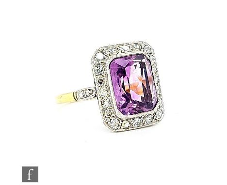 A mid 20th Century 18ct amethyst and diamond cluster ring, central emerald cut diamond, length 13mm, width 10mm, collar set w