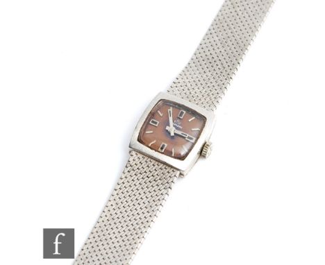 A lady's 9ct white gold Marvin manual wrist watch, batons to a square tan dial and integral 9ct white gold mesh bracelet, tot