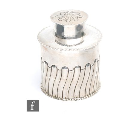 A hallmarked silver cylindrical tea caddy with part wrythen fluted body below pull off cover, weight 3oz, Birmingham 1905, El