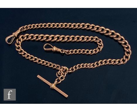 An early 20th Century 9ct rose gold graduated double Albert chain terminating in T bar and end swivels, weight 44g, length 42