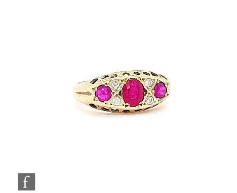 A 9ct Edwardian style ruby and diamond seven stone boat shaped ring, weight 2.3g, ring size L, Chester 1960. 