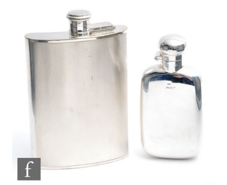 A hallmarked silver cushion rectangular hip flask of plain form, height 12cm, Chester 1898, with a later silver plated exampl