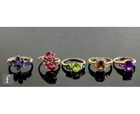 Five 9ct hallmarked stone set rings to include amethyst, smokey quartz and ruby examples, total weight 13g, various styles an