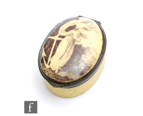 A late 18th Century Bilston type enamel pill or patch box of oval form decorated to the slightly domed cover with a lady look