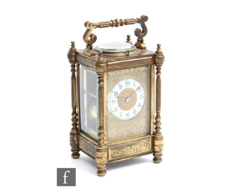 A late 19th to early 20th Century brass cased carriage clock with platform escapement and push button repeat, the eight day m