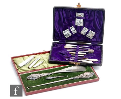 A cased sewing set with ten implements and three needle packets, a cased hallmarked silver shoe horn with two button hooks an