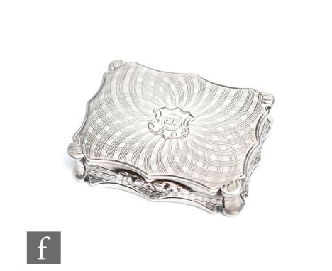 A Victorian hallmarked silver shaped rectangular vinaigrette with engine turned swirl pattern to hinged cover and base, openi