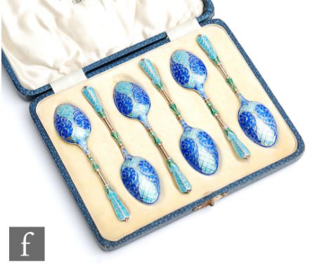 A cased set of six hallmarked silver and enamelled tea spoons each with blue and green enamel decoration to twisted stems and