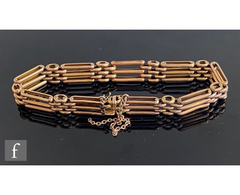 A 9ct rose gold three bar gate bracelet terminating in tongue and box fastener, weight 14g, length 20cm. 