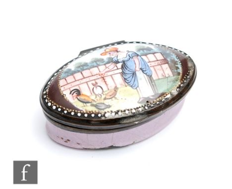 A late 18th to early 19th Century Bilston enamel oval pill or patch box decorated to the slightly domed top with a hand paint