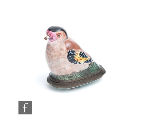 A late 18th to early 19th Century enamel bonbonniere formed as a goldfinch with painted feathers and features, the hinged lid