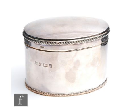 A modern hallmarked silver oval tea caddy of plain form with gadroon borders to foot rim and hinged cover, weight 19oz, Birmi