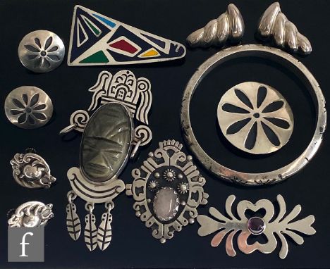 A parcel lot of Mexican silver jewellery to include a triangular brooch with enamel decoration, a bangle, earrings and a broo