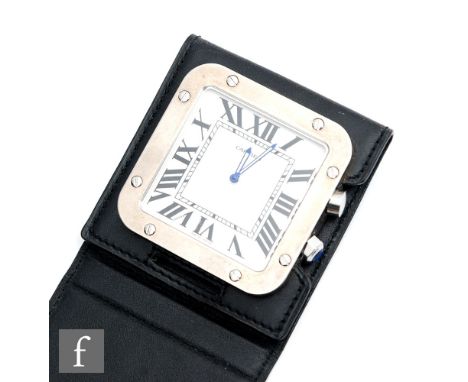 A stainless steel Cartier Santos travel alarm clock, model number 2750, Roman numerals to a cushioned square dial, case diame