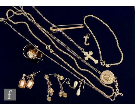 A small parcel lot of assorted jewellery to include a cross and chain, a St Christopher and chain, earrings, a bar brooch, ca