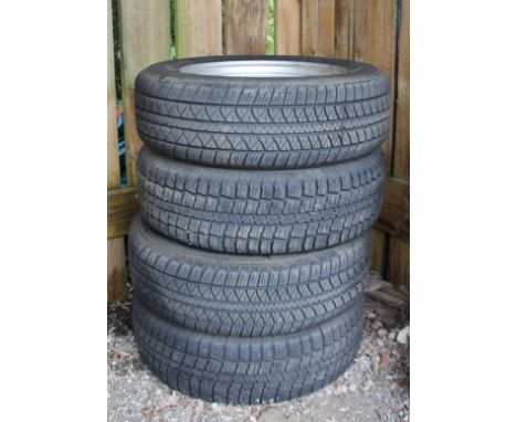 A set of Four Suzuki Jimny steel wheels, shod with Dunlop SP65is 195/65/R15 tyres 