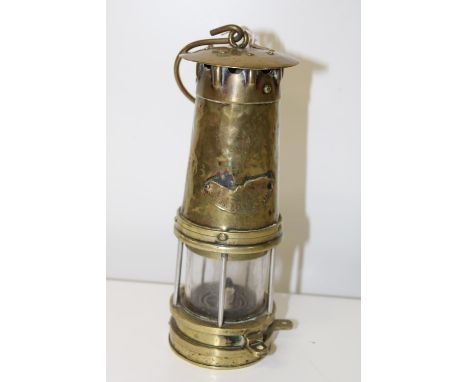 A vintage brass miners lamp 