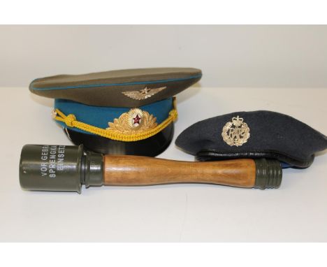 A RAF beret &amp; Russian General's cap, along with a dummy German stick grenade 