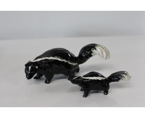 Two Beswick skunk figures 