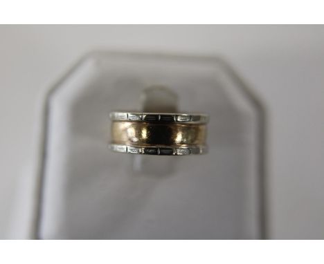 A unusual 9ct gold wide barrel ring size M 