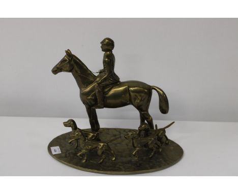 A heavy brass hunting themed sculpture 