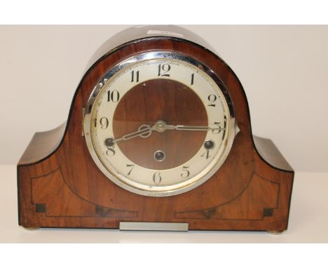 A working vintage walnut cased chiming mantel clock 