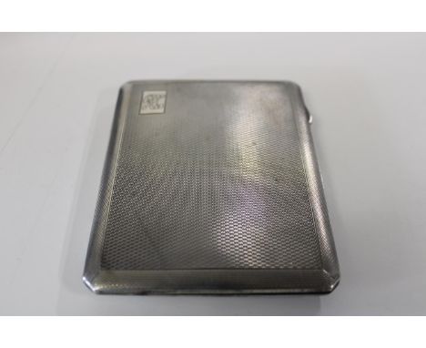 A hallmarked silver &amp; gilt cigarette case with engine turned decoration 