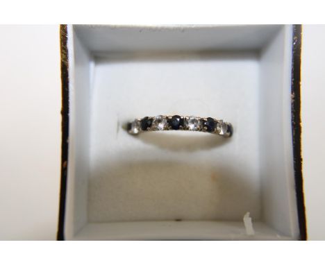 A 9ct gold sapphire half eternity ring size L 
