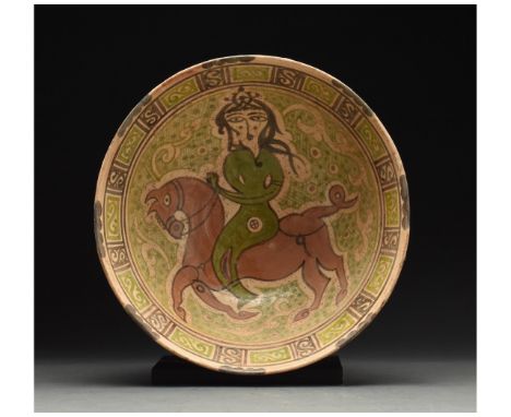 901 - 1000 AD or later. Medieval Islamic terracotta plate or bowl in a light brown fabric with a glazed interior. The interio