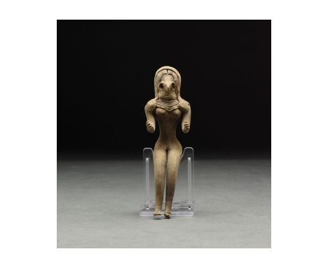 C. 3rd millennium BC. A lovely buff-coloured handmade fertility idol of characteristically abstract form with delineated legs