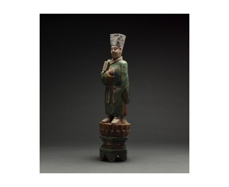 Ca. 1368-1644 AD. Chinese Ming Dynasty Attendant Figure. A large and elaborately crafted male attendant figure dressed in a d