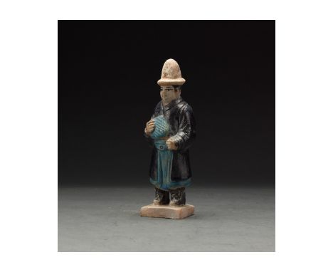 Ca. 1368-1644 AD. Chinese Ming Dynasty Attendant Figure. An elaborately crafted male attendant figure dressed in a light blue