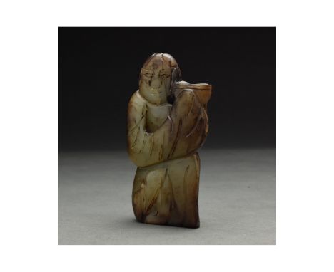 A yellow and russet jade Song-style carving figure of monk and bird, China, 19/20th century Size: H:109.2mm / W:62.1mm ; 300g