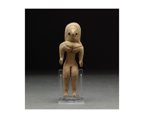 C. 3rd millennium BC. A lovely buff-coloured handmade fertility idol of characteristically abstract form with delineated legs