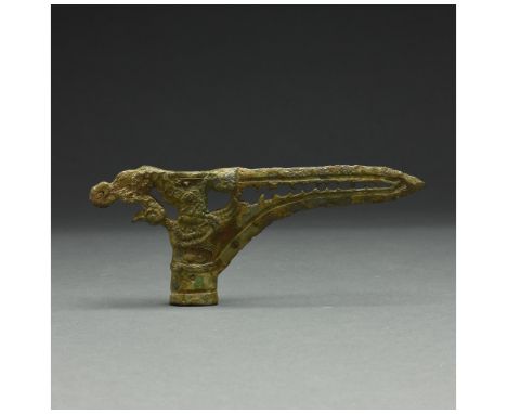 c. 475 BC – 221 BC. Warring States Period. Socketed bronze axe with long bevelled blade, culminating in a point and openwork 