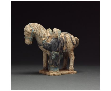 Ca. 1368-1644 AD. Ming Dynasty. White horse in standing position with neck extended and head bowed. The tail is free-flowing.