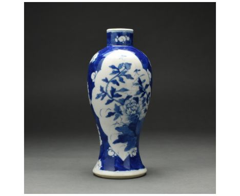 A blue and white vase with plum flowers and reserved with peony, China, 20th century or earlier / qing style. Used as a lamp 